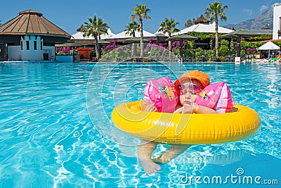 Baby in summer swimming pool resort Stock Photo