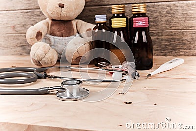 baby teddy bear with stethoscope and medicine Stock Photo