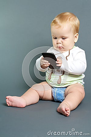 Baby texting smart phone Stock Photo