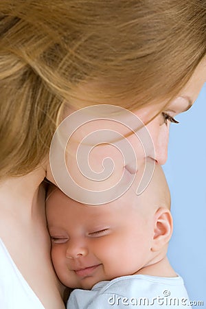 Baby of three months old in his mothers hands. Stock Photo