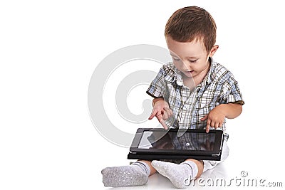 Baby toddler pointing confused at a digital tablet Stock Photo