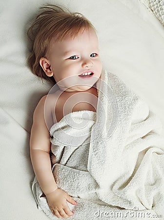 Baby with towels Stock Photo