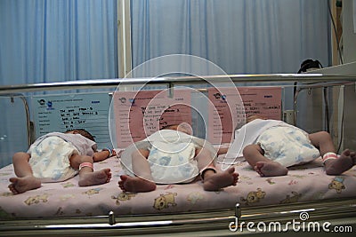 BABY TWINS THREE Editorial Stock Photo