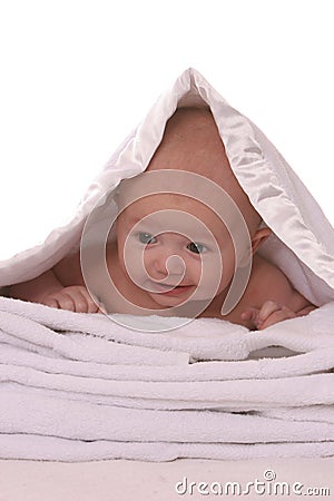 Baby under blanket Stock Photo