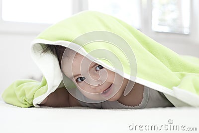 Baby under blanket Stock Photo