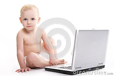 Baby using laptop Stock Photo