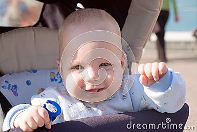 Baby walking in carriage Stock Photo