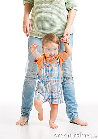 Baby Walking First Steps, Mother Helping Child to Go, on White Stock Photo