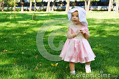 Baby walking in the park. Stock Photo
