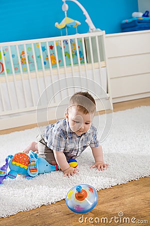 Baby and whirligig Stock Photo