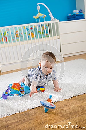 Baby and whirligig Stock Photo