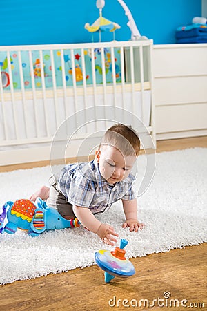 Baby and whirligig Stock Photo