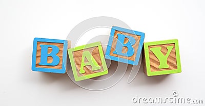 Baby word made from colourful wooden baby development blocks Stock Photo