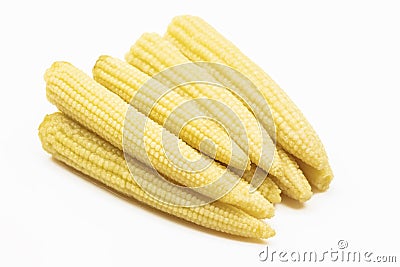 Babycorn pile isolated on white background. Small sweetcorn pickled salad Stock Photo