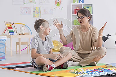 Babysitter and young boy Stock Photo