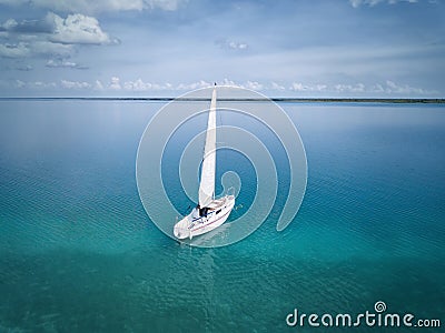 BACALAR, MEXICO, 07 OCTOBER 2017: White sailing boat in the lagoon - shot from drone Editorial Stock Photo