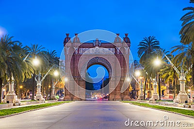 Bacelona Arc de Triomf at night in the city of Barcelona in Catalonia, Spain. The arch is built in reddish brickwork in the Neo- Editorial Stock Photo