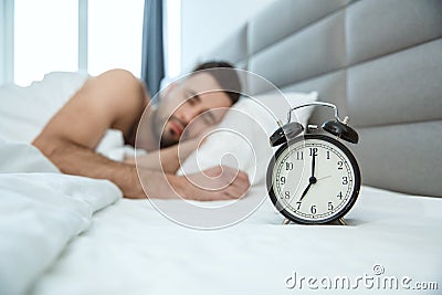 Bachelor man daily routine single lifestyle morning concept alarm clock Stock Photo