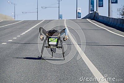 back athlete on racing wheelchair Stock Photo