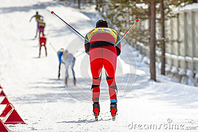 back athlete skier down mountain skiing at stadium Stock Photo