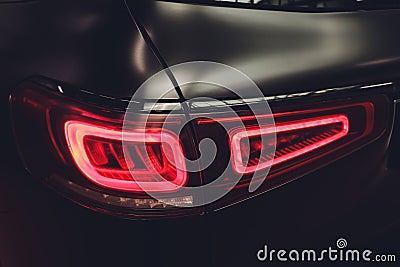 Back of black automobile with modern rear light. Stock Photo