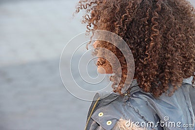 Back of girl's curly head of hair Stock Photo