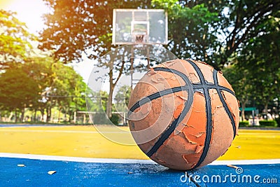 Old basketball in the basketball court. Stock Photo