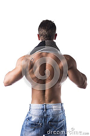 Back of hunky male bodybuilding model drying himself with towel Stock Photo