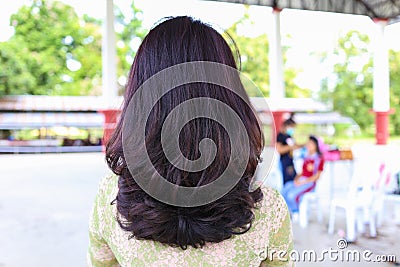 The back. The long hair of a young woman. purple hair highlights close-up Stock Photo