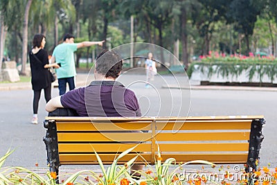 Man sitting on bench park Editorial Stock Photo