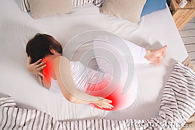 Back pain, kidney inflammation, woman suffering from backache at home Stock Photo