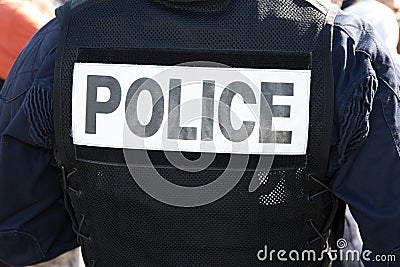 Back of a police officer in uniform Concept: Law & Order. Stock Photo