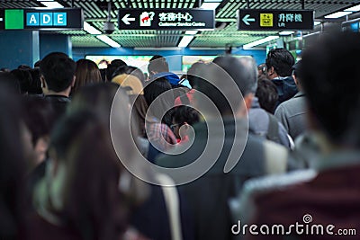 Back portrait crowd of passengers waiting for entering at the entrance of subway station during rush hours in morning Editorial Stock Photo