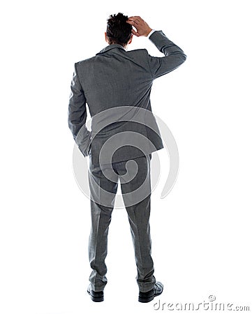 Back-pose of a corporate person thinking Stock Photo