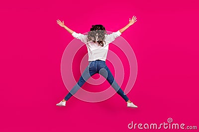 Back rear view full size photo of young girl star jump up active incognito anonym isolated over pink color background Stock Photo