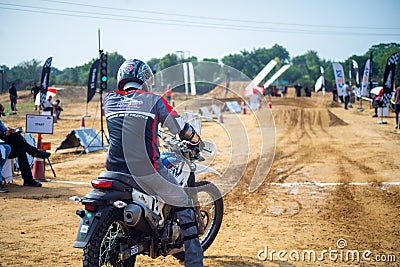 back shot of participant at hero dirt biking challange wearing the protective jacket preparing at the start line as Editorial Stock Photo