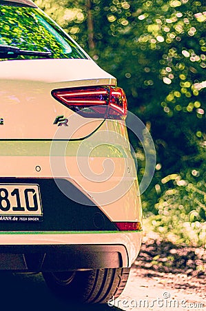 Back shot of a white SEAT Leon car in the forest with blur trees Editorial Stock Photo