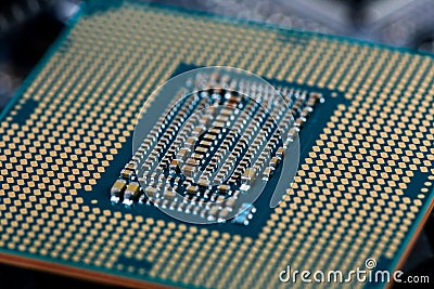 Back side of modern lga 1151v2 central processor unit - closeup with selective fcus and blur Stock Photo