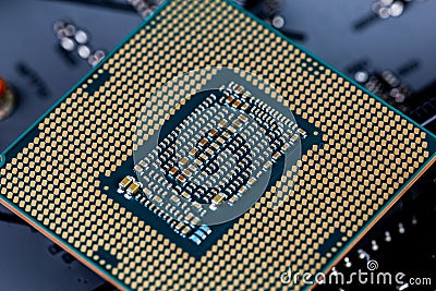Back side of modern lga 1151v2 central processor unit - closeup with selective fcus and blur Stock Photo