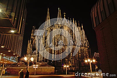 Back side of the Roman Catholic cathedral of Cologne or High Cathedral of Saint Peter at night. Editorial Stock Photo