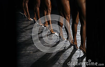 Back slender legs women fitness bikini bodybuilding competitions Stock Photo