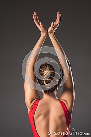 Athletic woman rising her arms Stock Photo