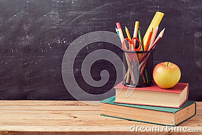 Back to school background with books, pencils and apple Stock Photo