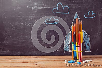 Back to school background with rocket made from coloured pencils Stock Photo