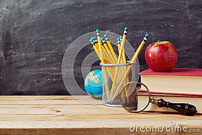 Back to school background with teachers objects over chalkboard Stock Photo