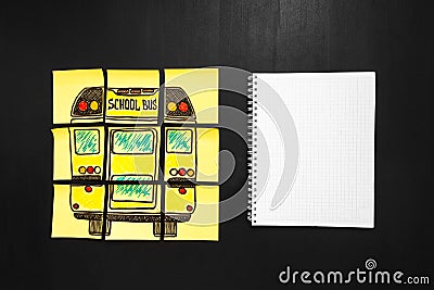 Back to school background with title `Back to school` and `school bus` written on the yellow pieces of paper and notebook Stock Photo