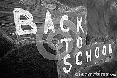 Back to school background with title `Back to school` written by white chalk on the black chalkboard Stock Photo