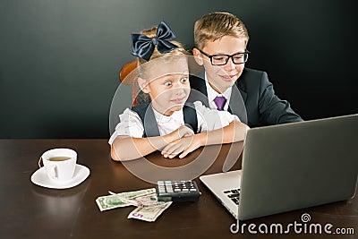 Back to school. Business kids smiling, uses laptop Stock Photo