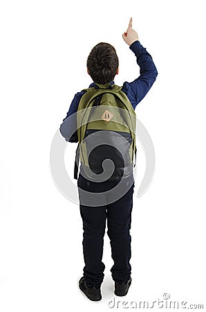 Back to school concept. Beautiful schoolboy with backpacks pointing at wall. Back view. Isolated on white background. Full length. Stock Photo