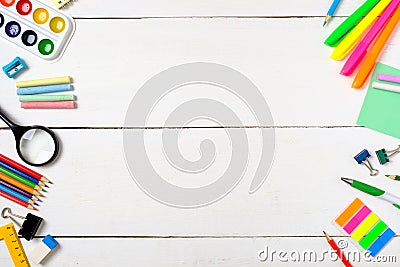 Back to school concept, border frame of colorful stationery supplies for teaching kids drawing on empty white wooden desk. Stock Photo